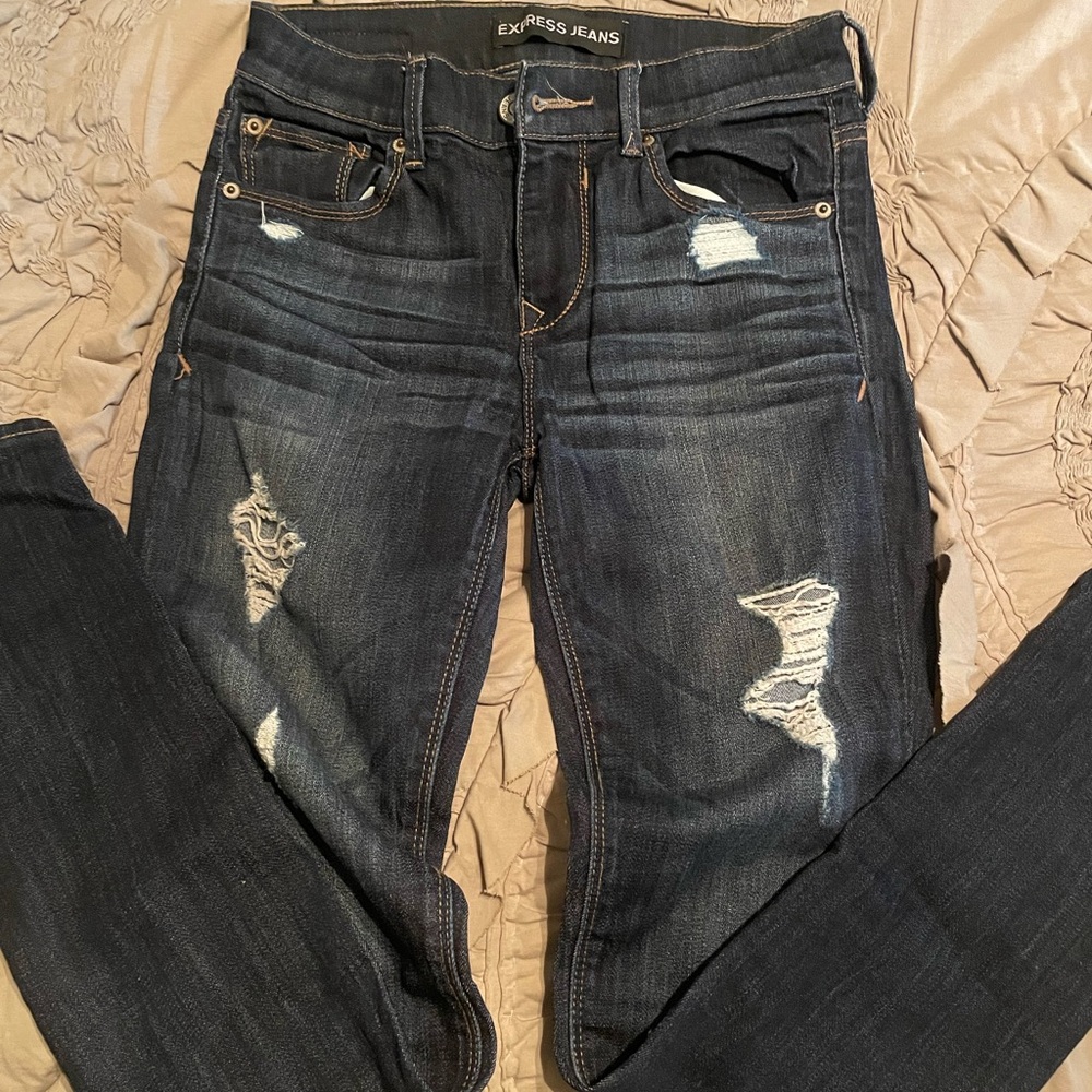 Express lightly distressed dark wash jeggings
